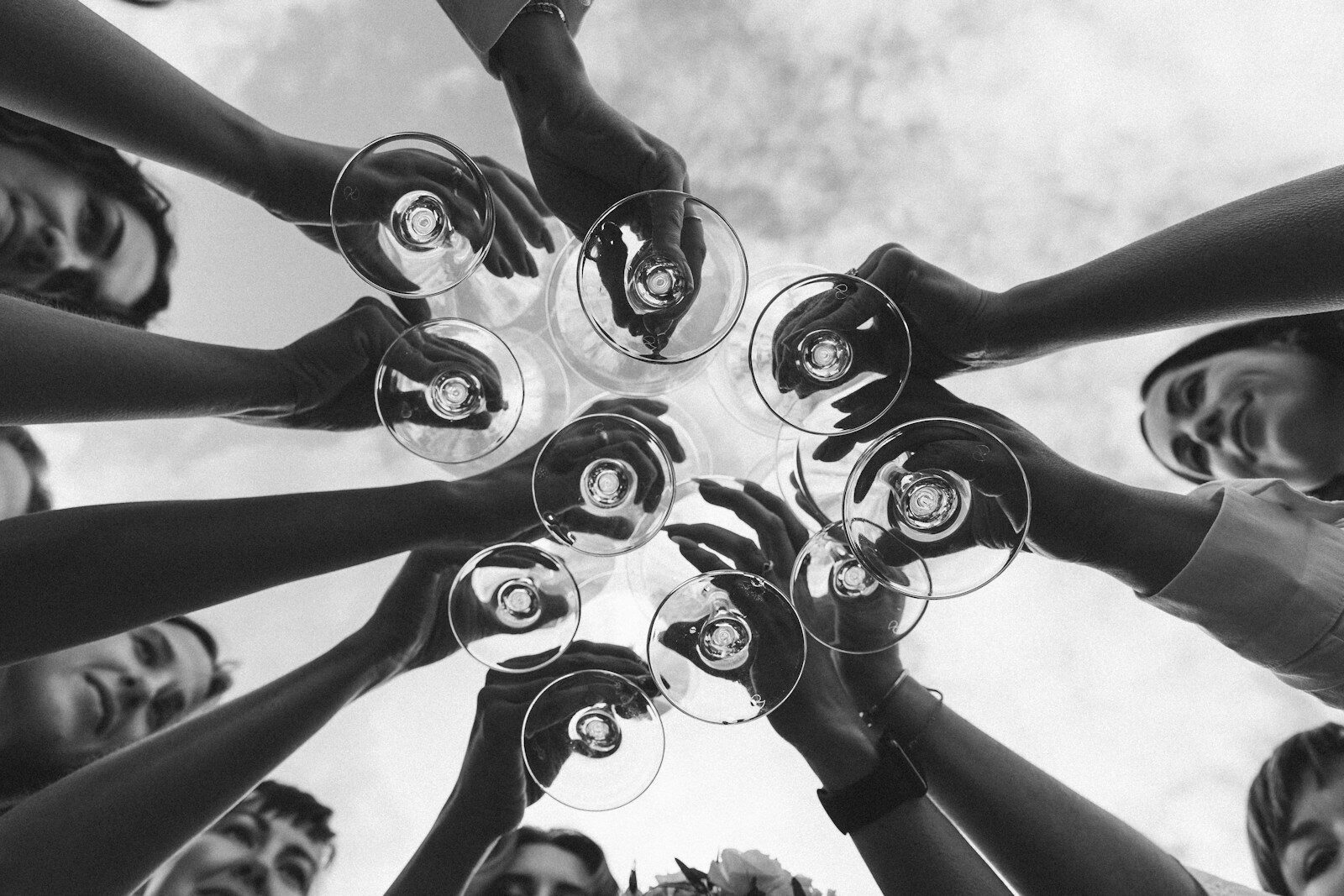 a group of people holding wine glasses