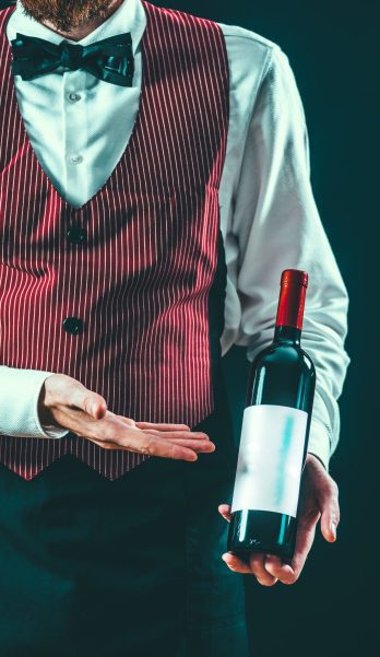 Sommelier with bottle of wine